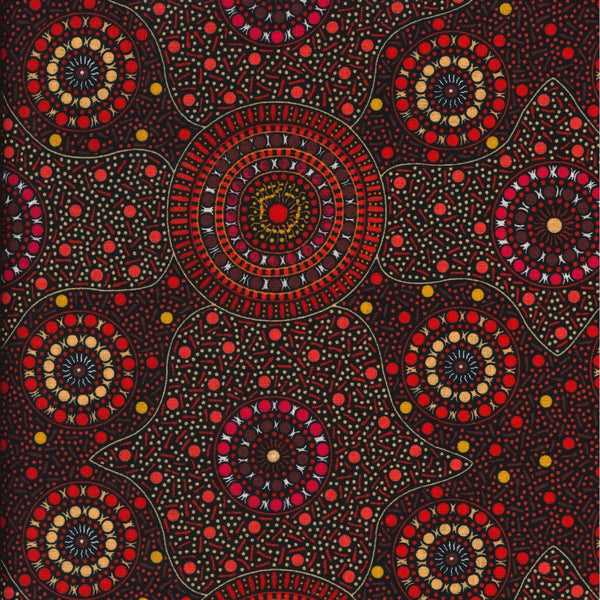 Waterhole &amp; Riverbed, flame orange, by Cathy Turner is a geometric design of concentric circles in red and smoky orange dots on a black background.