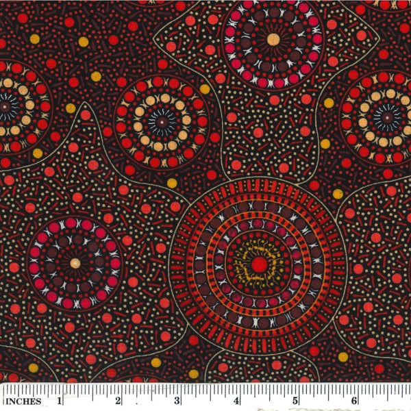 Waterhole &amp; Riverbed, flame orange, by Cathy Turner is a geometric design of concentric circles in red and smoky orange dots on a black background.