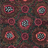 A close-up of a patterned fabric featuring stylized floral motifs in pink, red, teal, and olive green on a dark background.
