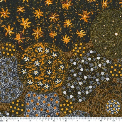 Wid Bush Tomato Gold australian fabric by Christine Doolan is a striking design in tans, gold, black and greys featuring flowers and lots of interconnected circles filled with different dot-based patterns. 