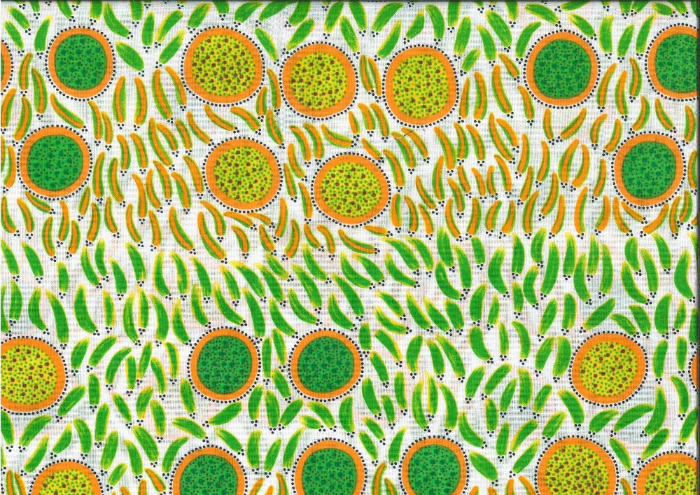The Wild Seeds and Bush Tucker emerald fabric, created by renowned Aboriginal artist Lorraine Granites, showcases stunning orange circles filled with vibrant yellow and green dots, as well as striking orange and green brush strokes that pay homage to traditional bush food, on a white background.