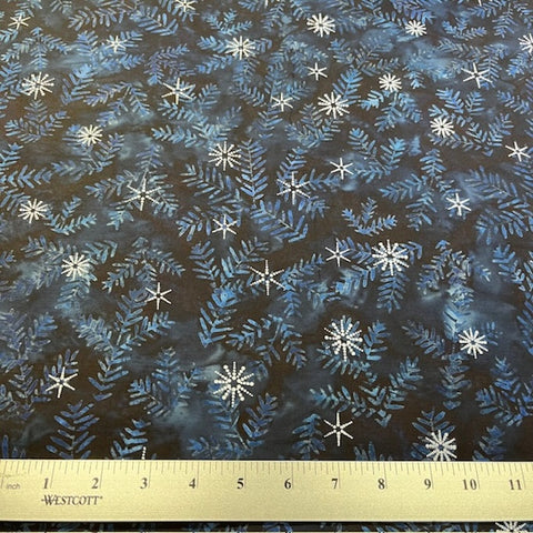 Winter Wonderland - Midnight is a festive winter design: darkish blue fir branches on a charcoal background with an overlay of sparkly stars in metallic silver. 