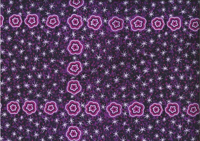  Women Watching Stars purple by Glenys Nagamarra Walker is an aboriginal design depicting twinkly white stars and purple stylized flowers on a purple background. 
