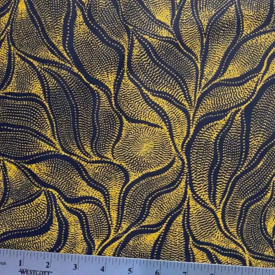 Sandhill and Waterhole Gold&nbsp;is a striking design by Aboriginal artist Anna Pitjara, featuring intricate golden yellow motifs on a deep black background.