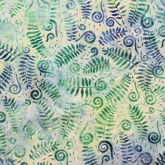 blue and green fern leaves and fiddlehead fabric with a ruler on the top