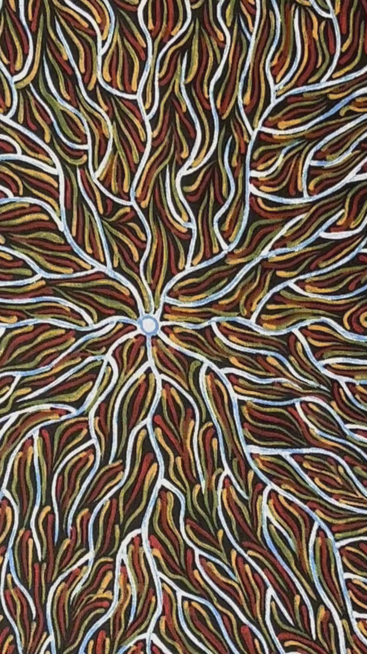 Running Water Dreaming&nbsp; brown is an intricate design of fine lines in white, brown, beige and black, simulating the rivulets of water splashing from a central waterhole.