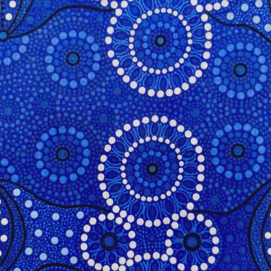 Campsite blue is a striking design in several brilliant shades of blue with white circle accents by Aboriginal Artist Bernadine Wallace.