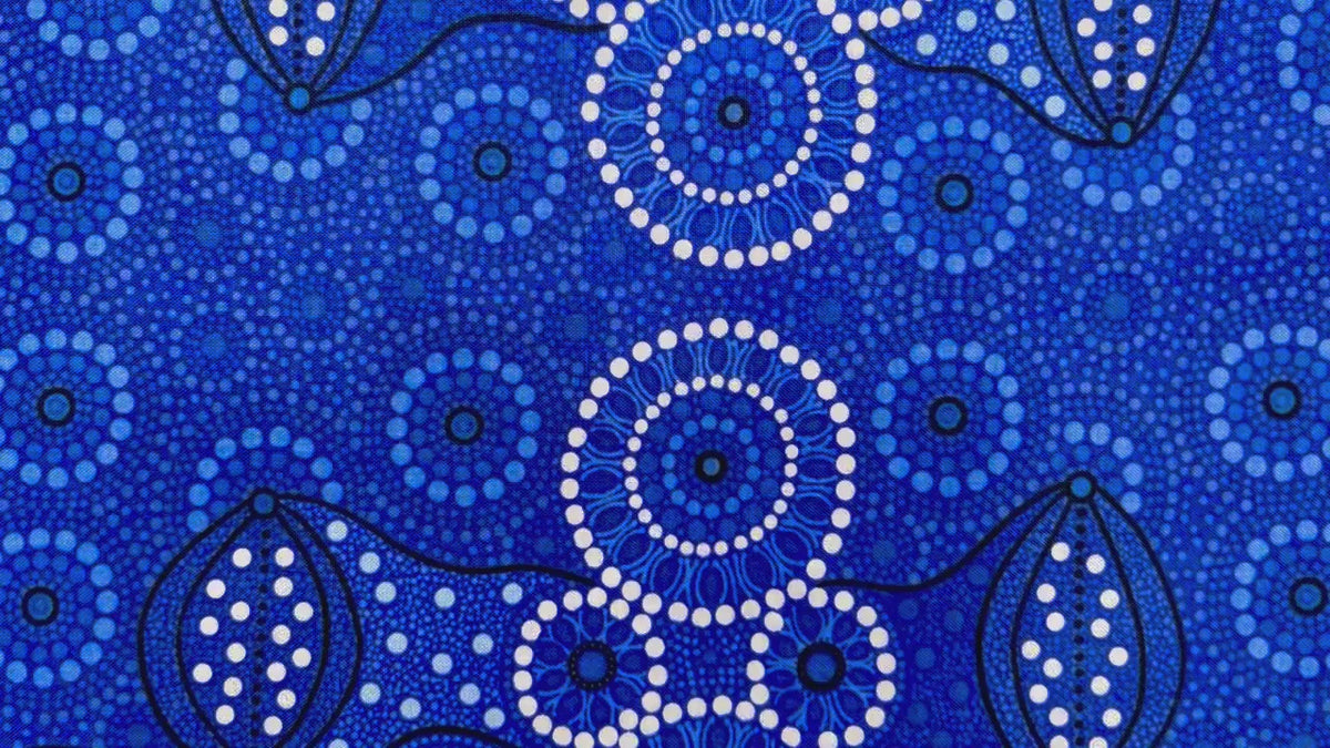 Campsite blue is a striking design in several brilliant shades of blue with white circle accents by Aboriginal Artist Bernadine Wallace.