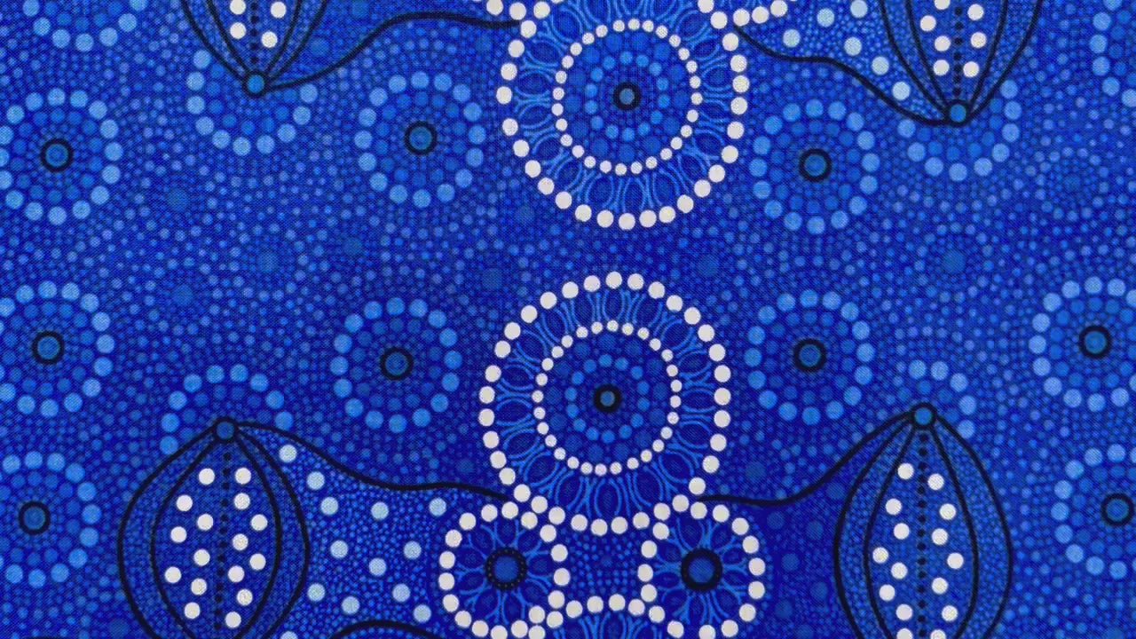 Campsite blue is a striking design in several brilliant shades of blue with white circle accents by Aboriginal Artist Bernadine Wallace.