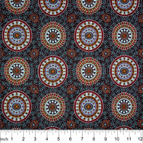 Alura Seed Dreaming Red Australian Aboriginal Fabric by Karen Bird depicts the Alura seeds arranged in circles, with decorations in tan, purple and white surrounding it. The design is printed on a black background