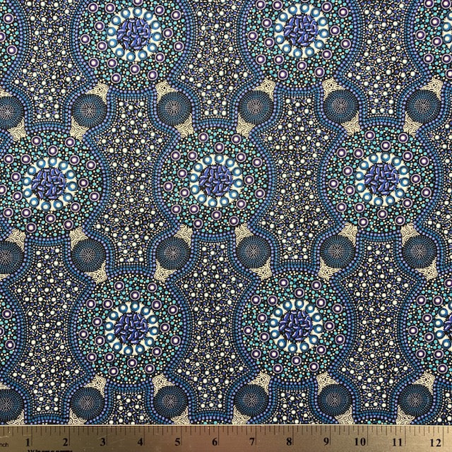 Bush Flowers blue  Australian Aboriginal fabric is an intricate design depicting flowering bushes in rich shades of blues, periwinkles and white on a black background.