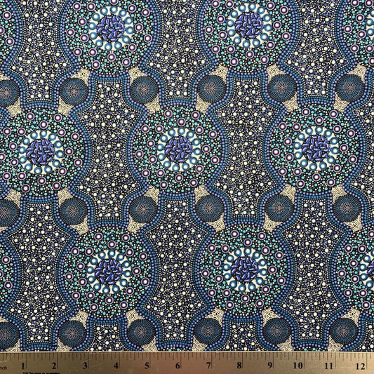 Bush Flowers blue  Australian Aboriginal fabric is an intricate design depicting flowering bushes in rich shades of blues, periwinkles and white on a black background.