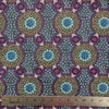 Bush Flowers  purple Australian Aboriginal fabric is an intricate design depicting flowering bushes in rich shades of purples, lavenders and olive on a black background.