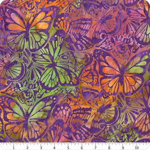 Butterflies Ivory is a lovely batik, depicting orange and green butterflies on a purple background. 