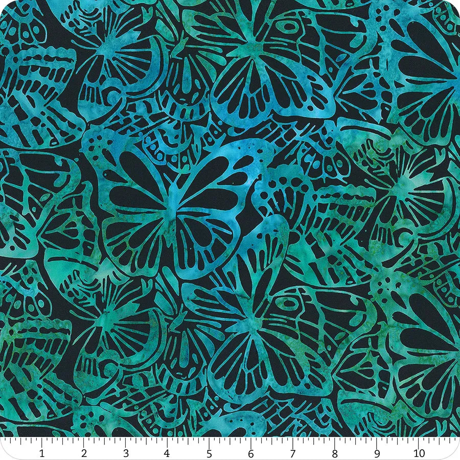 Butterflies Ivory is a lovely batik, depicting blue and green butterflies on a super-dark navy background.