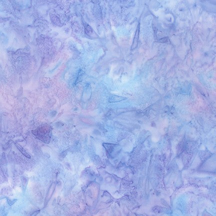 Indonesian artists created this lovely hand painted Batik fabric with a mottled pattern in lilac, wisteria and pastel periwinkles.