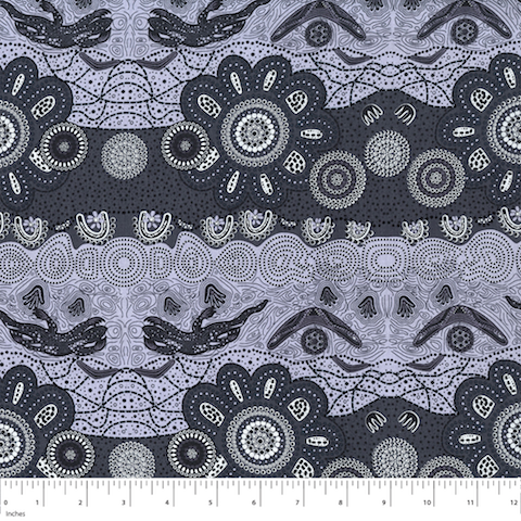 Home Country Ash Australian Aboriginal fabric is a delightful design in different shades of grey and charcoal, depicting flowers, boomerangs and goannas. 