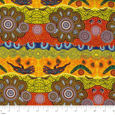 Home Country Gold Australian Aboriginal fabric is a delightful design in brilliant shades of gold, orange, red and olive, depicting flowers, boomerangs and goannas. 