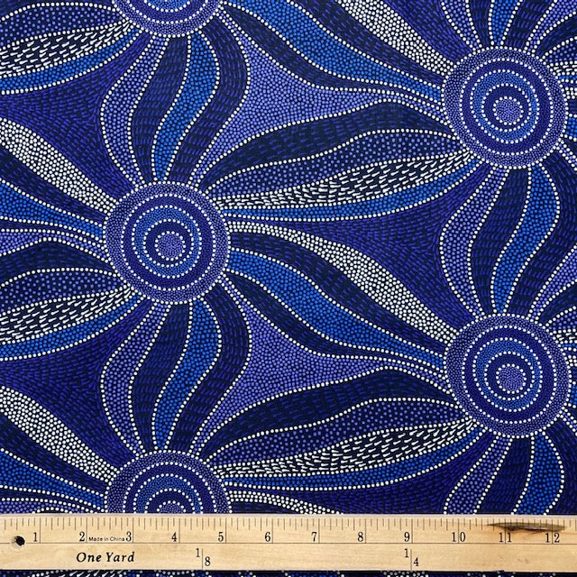 Ladies Dancing with Water Pains blue Australian Aboriginal fabric is a large scale flowing design in blues, lavenders and white on a black background
