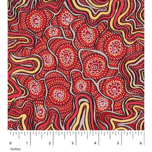 Meteors Red Australian Aboriginal fabric by Heather Kennedy depicts a slew of meteors dotting the red and yellow sky.