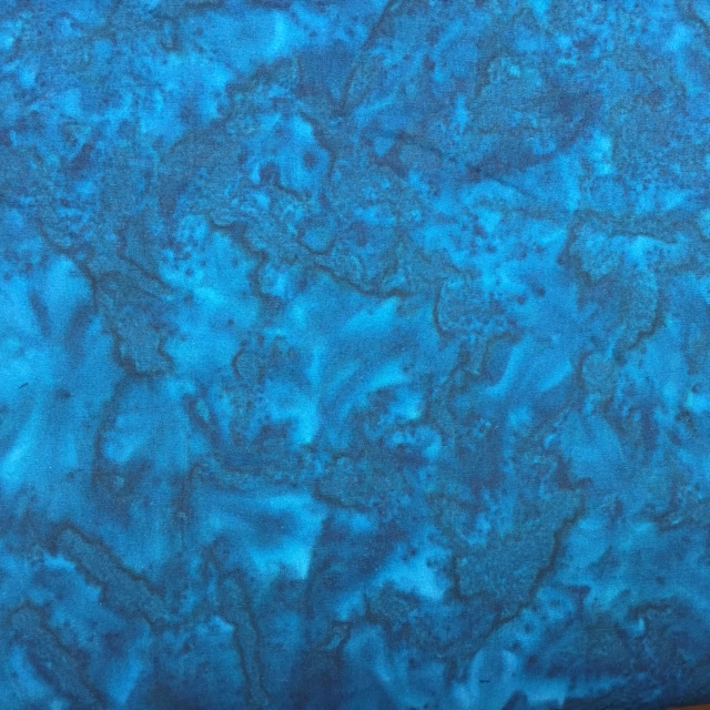  100 % fine cotton Patina fabric was dyed by talented artisans to make it look like the darkest teal on a peacock's feather
