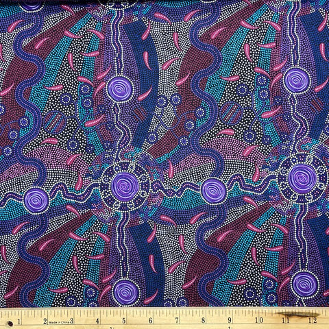 Roaring Forties purple Australian Aboriginal Fabric by Greg Matthews is a thoughtful design in vibrant shades of purples, lavender and turquoise on a black background.