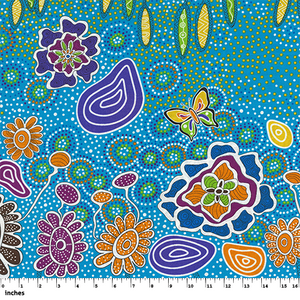 Summertime Rainforest blue Australian Aboriginal fabric by Heather Kennedy is a delightful representation of colorful flowers and butterflies on a bright blue background. 