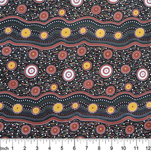 Wild Beans Black Australian Aboriginal fabric depicts women collecting wild beans in rust and orange on a black background